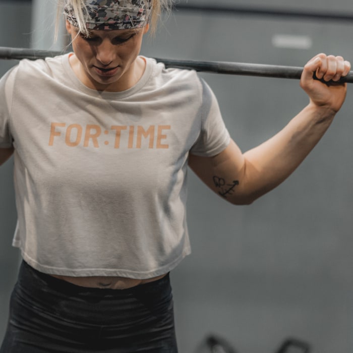 Female Athlete wearing FOR:TIME LOGO tee