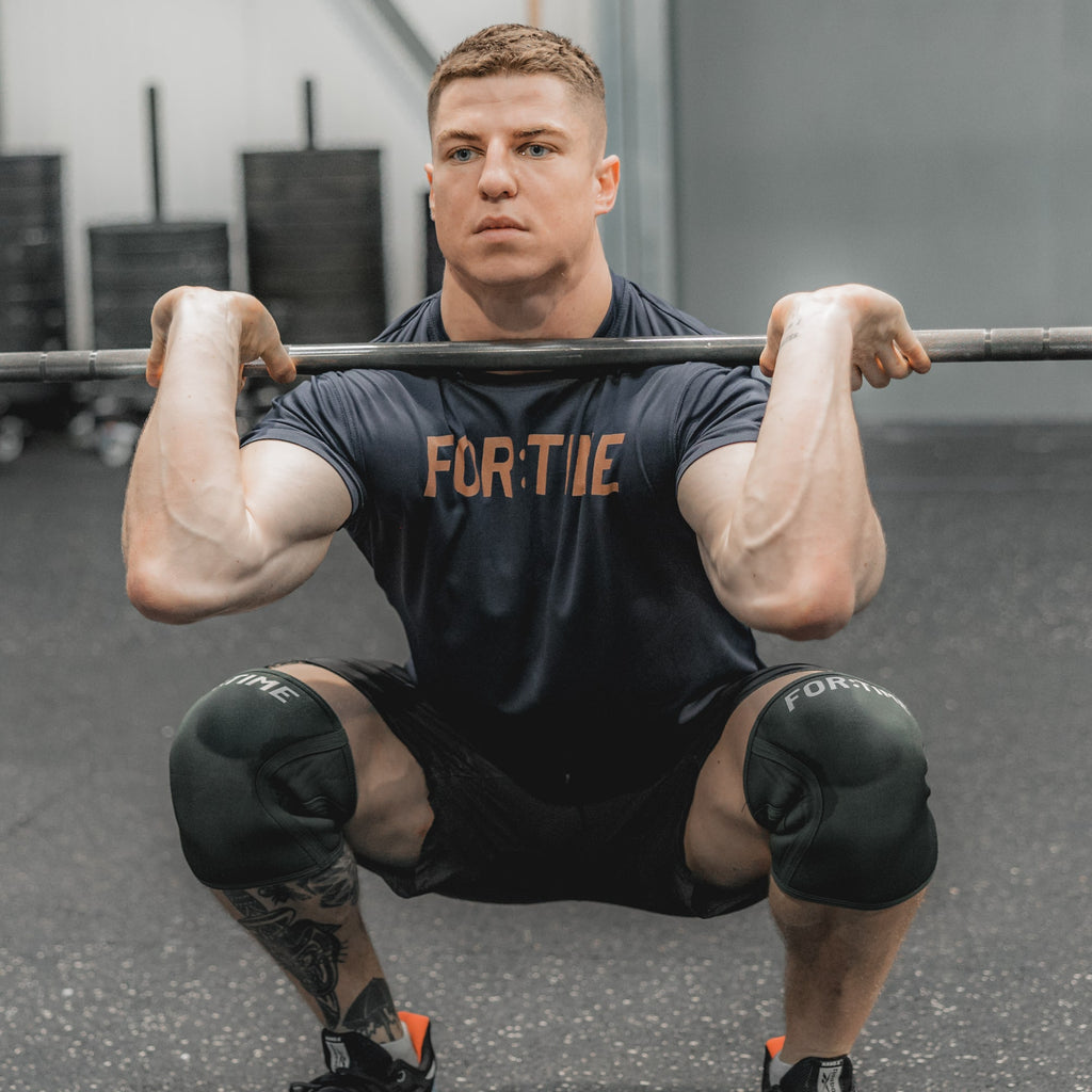 Power On CrossFit Knee Sleeves by FOR:TIME FITNESS on CrossFit Athlete Toby Buckland performing a front squat